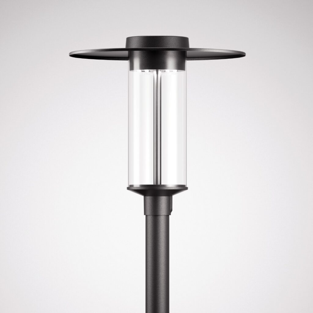 Modern svart utomhusarmatur från PROLJUS AB med cylindrisk klar glaskupa och platt metallskärm, energieffektiv LED som ger jämnt bländfritt ljus för gångvägar och parkmiljöer