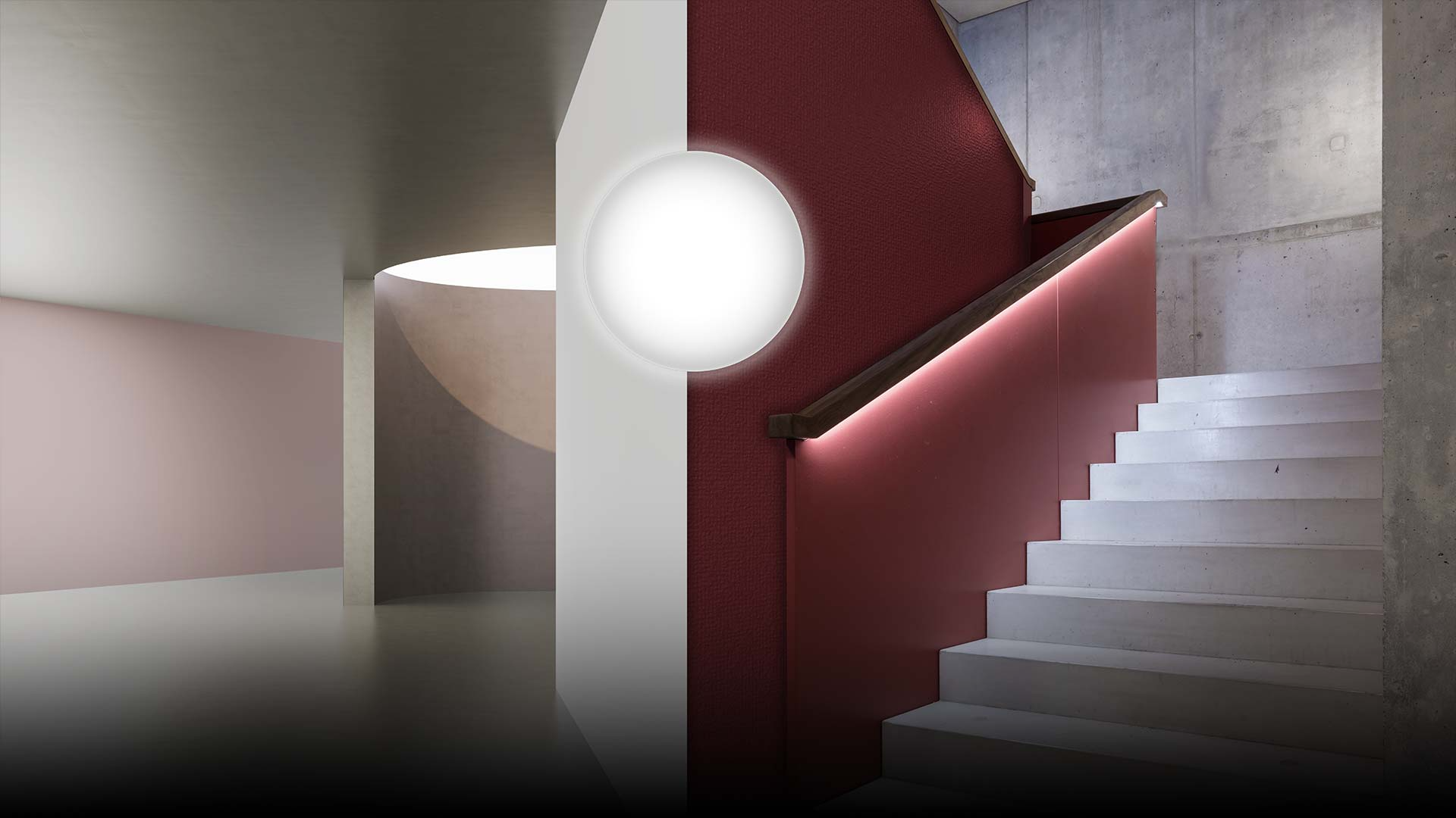 Trappa och entré upplysta av PROLJUS ABs runda väggarmatur som sprider ett mjukt, jämnt sken och en diskret LED-list under ledstången som ger trygg, energieffektiv vägledning och framhäver arkitekturen