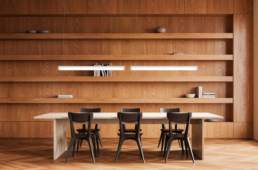 Två slanka linjära LED-pendellampor från PROLJUS AB hänger över ett matbord i ett varmt trärum och ger jämnt varmvit ljus som framhäver trästrukturen, energieffektiva och minimalistiska armaturer för både hem och offentlig miljö