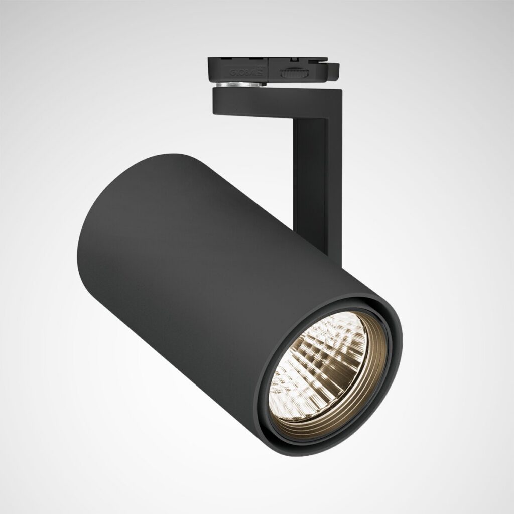 Svart cylinderformad skenspotlight med justerbar arm och guldtonad reflektor, energieffektiv och stilren belysning perfekt för butik, galleri och hem från PROLJUS AB